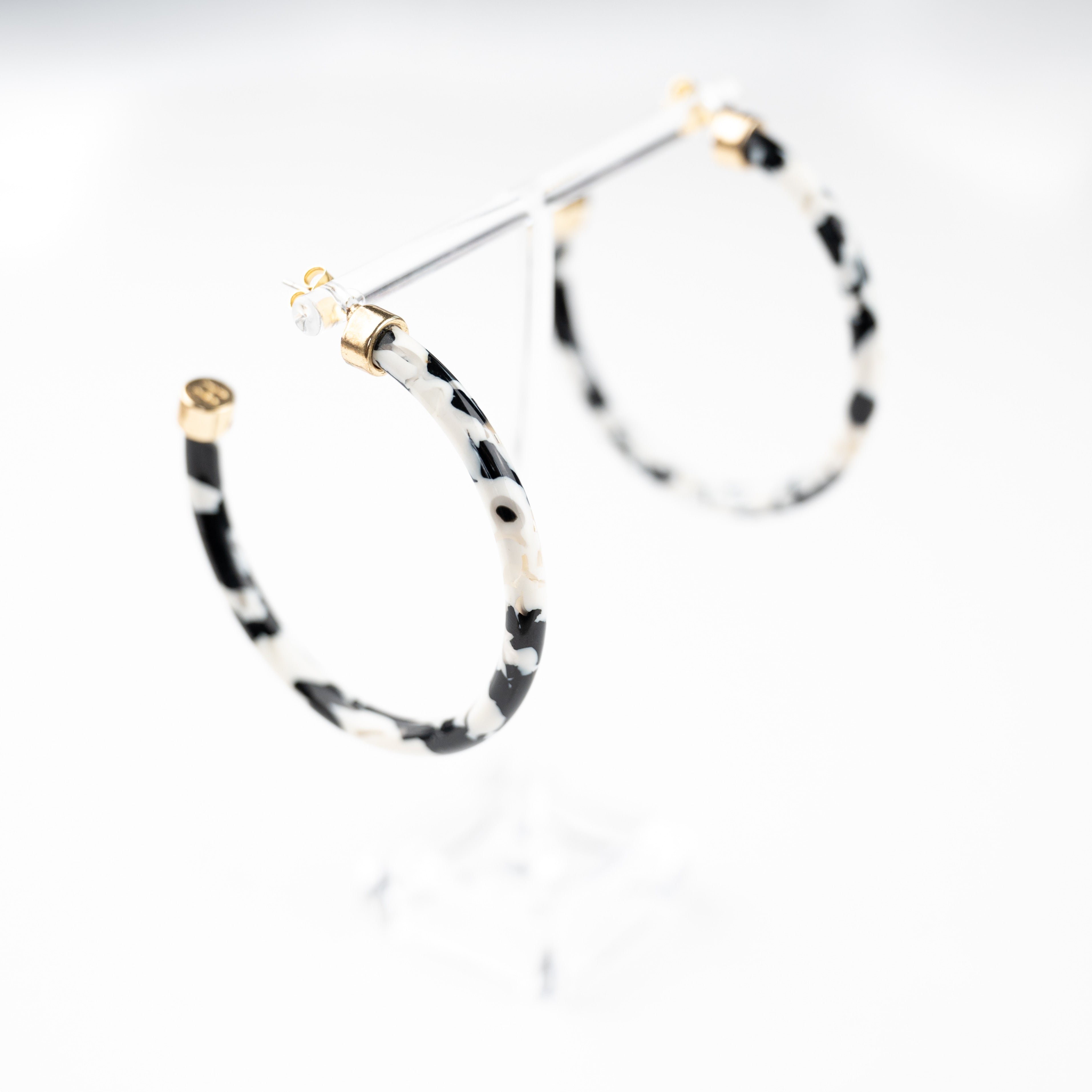 Black and shop white hoop earrings